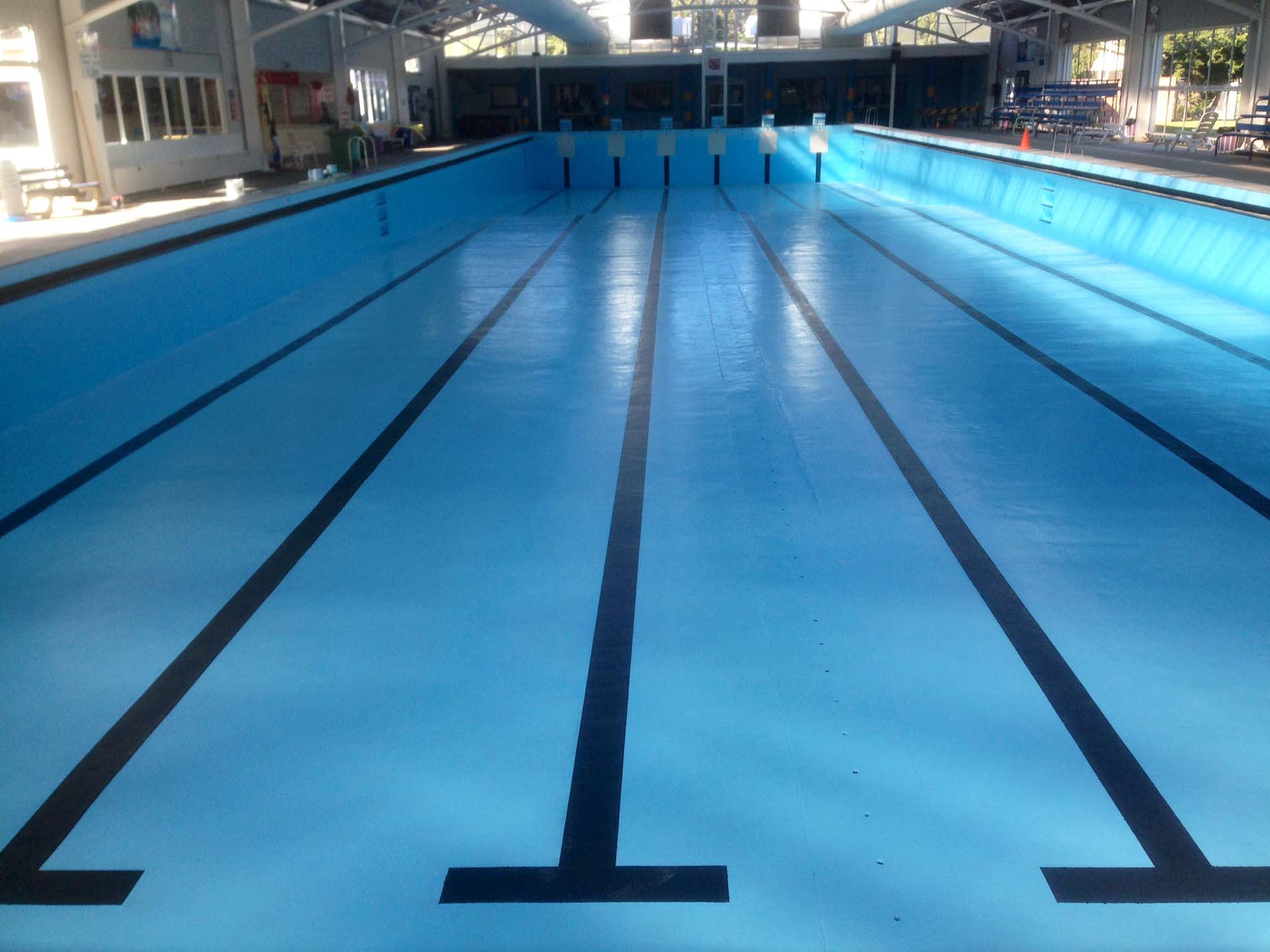 North Bondi olympic-size pool without water painted with Luxapool epoxy pacific blue