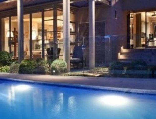 Pool painted in LUXAPOOL® epoxy pool paint in Jacaranda colour by Murray Jones, shown at night