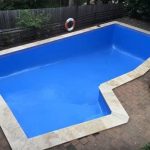 Empty blue swimming pool