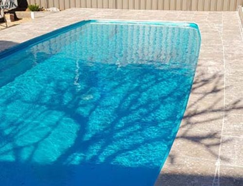 Residential pool painted in LUXAPOOL Epoxy Turquoise colour in partial shade