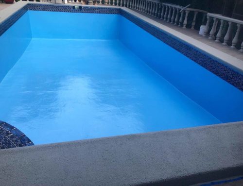 Domestic pool resurfaced with LUXAPOOL® Misty Blue and pool coping painted with Light Grey Poolside & Paving by Hills Pool Painting and Renovation