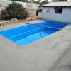 Before and after pool surrounds renovated over pebblecrete with LUXAPOOL poolside & paving in Winter Brown 