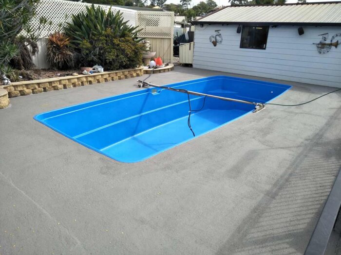 Before and after pool surrounds renovated over pebblecrete with LUXAPOOL poolside & paving in Winter Brown 