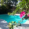 Backyard swimming pool resurfaced with LUXAPOOL Epoxy in Crestwood colour, and LUXAPOOL Poolside & Paving in Shale Grey on the pool surrounds.