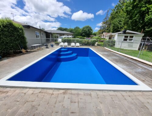 Fibreglass swimming pool repainted with LUXAPOOL® Epoxy in Devonport colour by Morris Coatings NZ