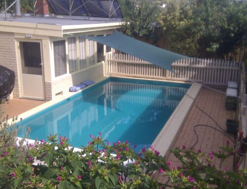 Residential swimming pool painted with LUXAPOOL® Epoxy pool paint in Atlantis colour, after being filled with water